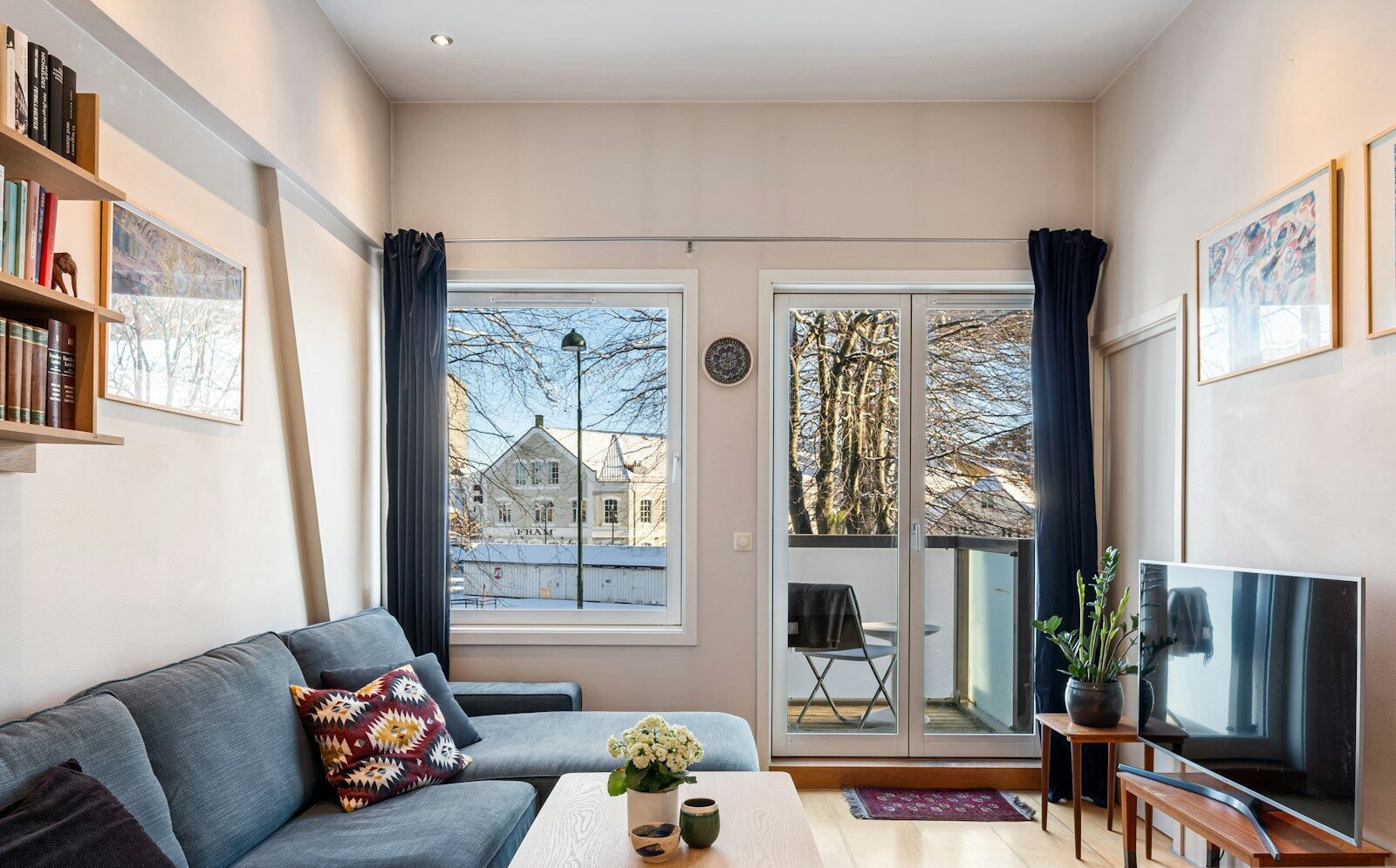 A living room filled with furniture and a flat screen TV