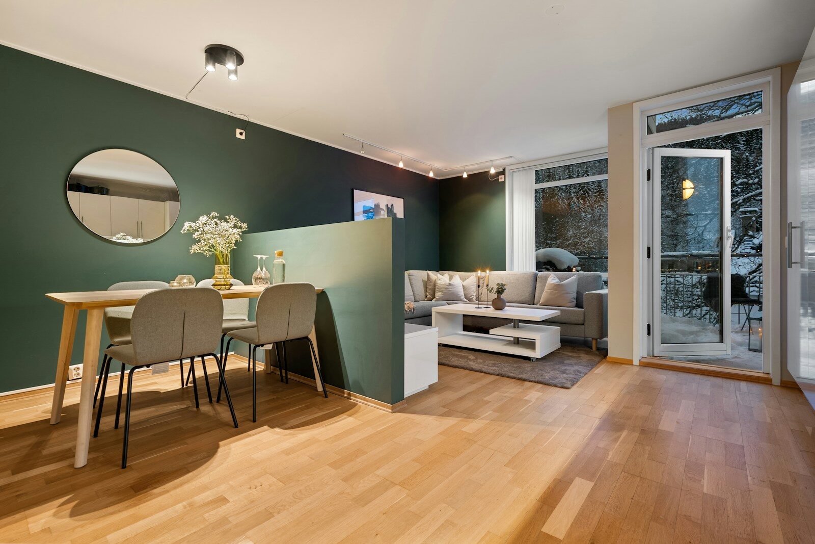 A living room filled with furniture and a wooden floor